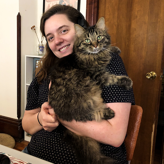 Hannah Hankins, Member Coordinator, holding her cat Ferdinand!